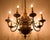 A monumental antique dutch-style bronze chandelier featuring eight arms, dating back to the first half of the 19th...
