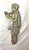 This antique handmade figural green iridescent glazed pottery wall tile is a unique and decorative piece that adds a touch...