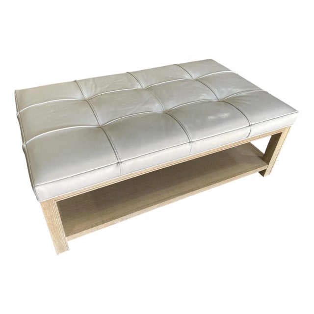 Highland House 1399-48 Franco Cocktail Ottoman With Off-White Tufted Leather Cushion and Lower Oak Shelf For Sale
