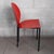 Stunning and elegant Gioconda chair of modern Italian art, made of red sheet metal with legs painted in black epoxy....