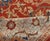 An early 20th century antique Sultanabad rug, the rust field with enlarged palmette and floral trellis overall within the...