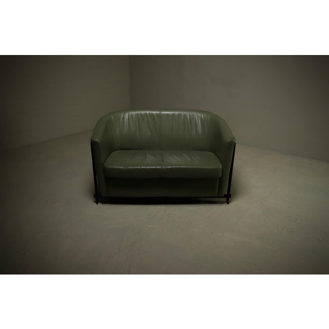 Postmodern club sofa manufactured by Touché during the peak of the 1980s design movement, is a striking balance of form...