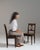 This pair of 19th century carved oak chairs from France, made in dark oak with pierced, shaped backs and solid seats. The...