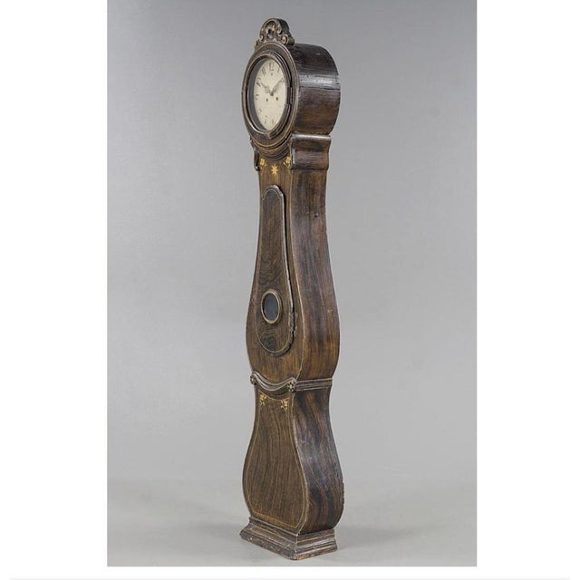 Antique Swedish mora clock from the 1800s in rare faux wood grain folk art finish finish and a superb detailed roman...