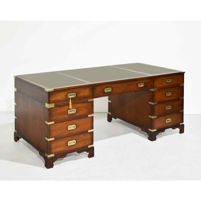 So handsome! Classic, substantial, and beautifully detailed, this mid-century English campaign partner desk brings...