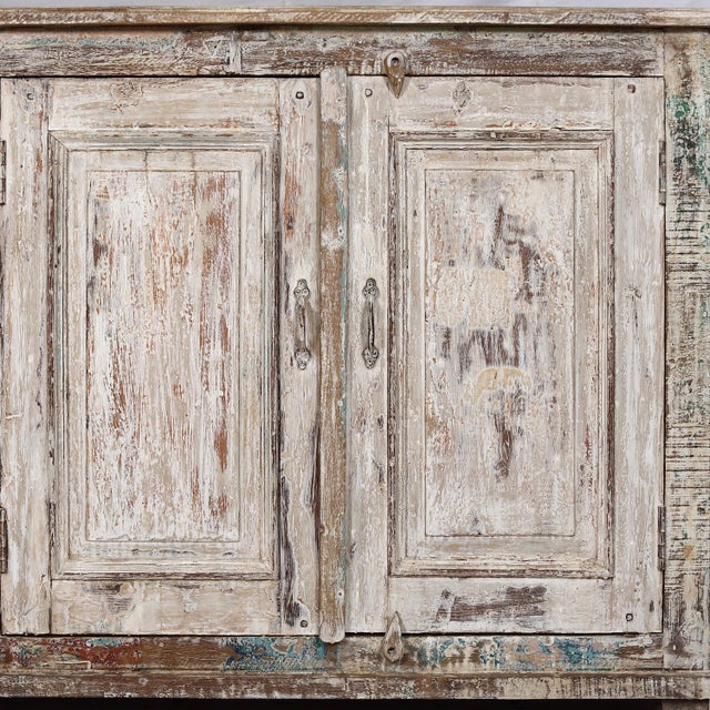 Sideboard/buffet made from Antique Indian Teakwood Architectural Elements, the natural rectangular teak panels and case...