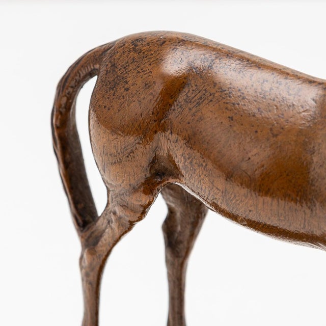 Antique early 20th Century Victorian Solid Wood Horse. Expertly carved from a piece of walnut, this striking horse stands...