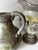 Vintage, stoneware, matching sister pitchers or vases. Both with a gloss base of antiqued or distressed sage, verdigris...