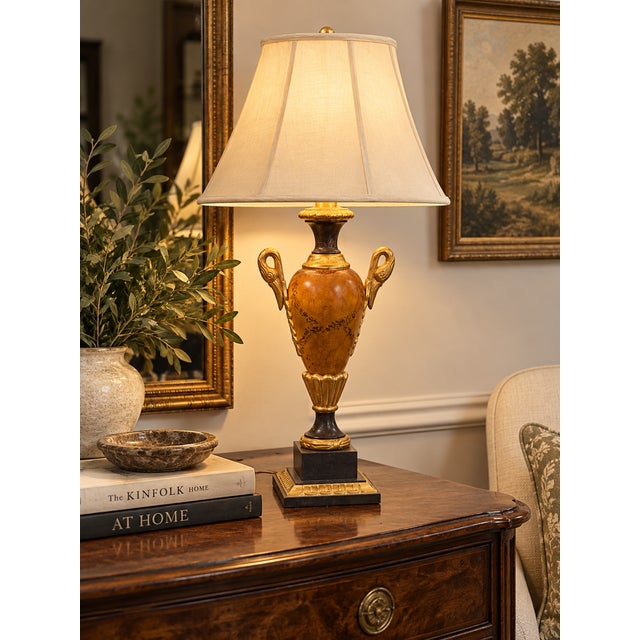Elegant vintage Neoclassical table lamp modeled after a classical two-handled urn, featuring a warm amber-brown marbleized...