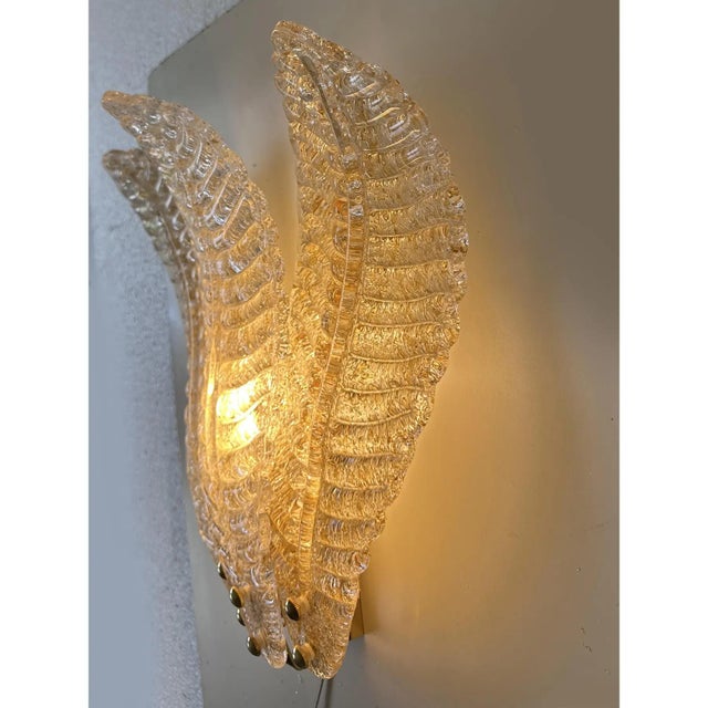 Contemporary luxury wall sconces in gold metal frame with leaves in murano glass and amber graniglia.set of two. a piece...