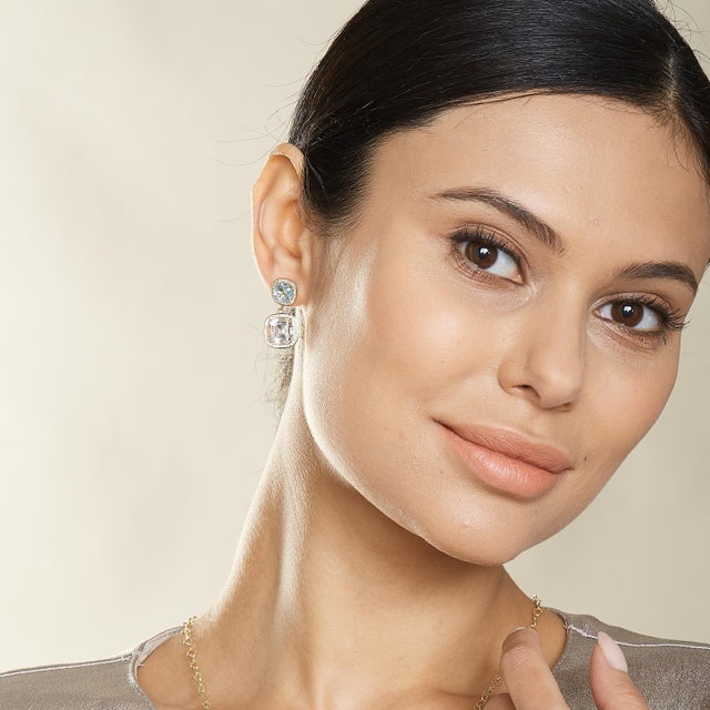 Created in 18kyg Blue Topaz cushions 2.5 cts approx Rock crystal cushions 8 cts approx Diamonds 0.60 cts approx Limited...