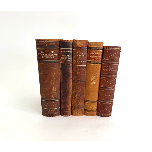 Set of five Swedish leather bound books dating from 1887 to 1946. Perfect for layering and elevating displays.