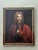 This magnificent 18th-century original oil on canvas portrait depicts a distinguished gentleman, likely a military...