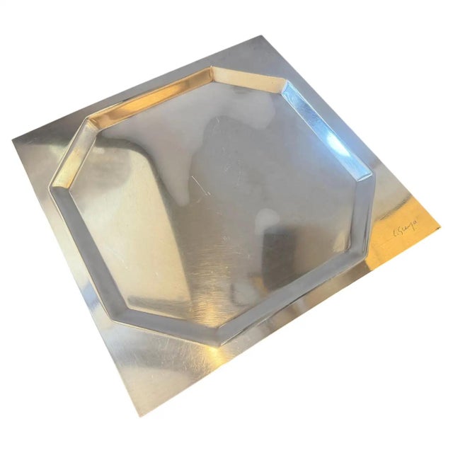 An iconic piece of twentieth-century Italian post-modernist design, this silver-plated square tray was created by master...