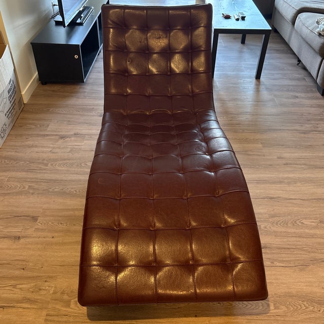sophisticated “Dolce” chaise by Roche Bobois, crafted in rich distressed brown leather and accented with sleek aluminum...