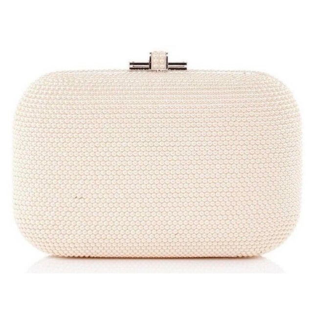 Judith Leiber’s Slide-Lock clutch is a classic silhouette to see you through a full calendar of invite-only events....
