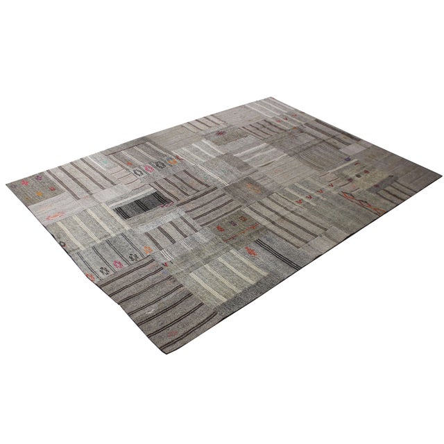 A beautiful Vintage Patchwork Kilim. It's in very good condition, practically new. This Patchworks kilim is produced of...