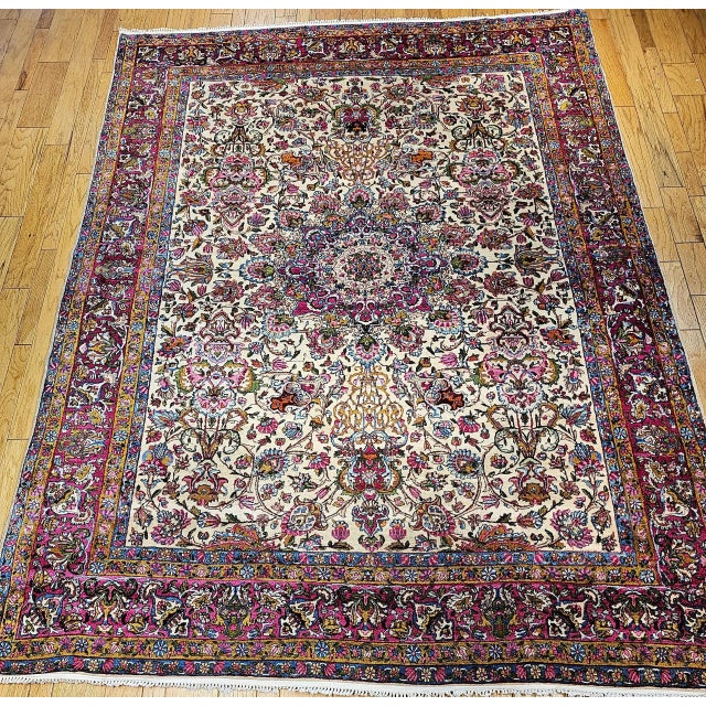A magnificent Persian Kerman Lavar room size rug circa the early 20th Century. This rug features a captivating all-over...