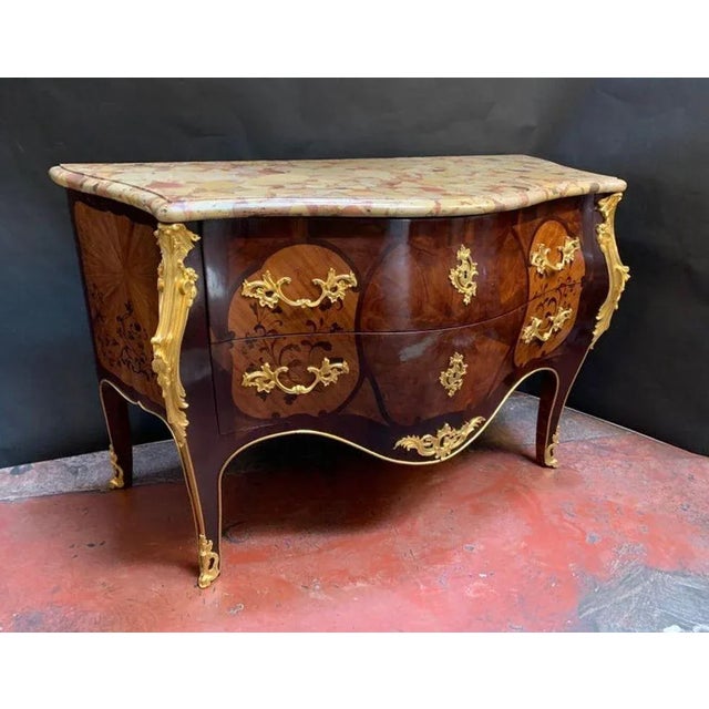 Louis XV style gilt bronze marquetry commode with mounted marmol. France, early 20th century.