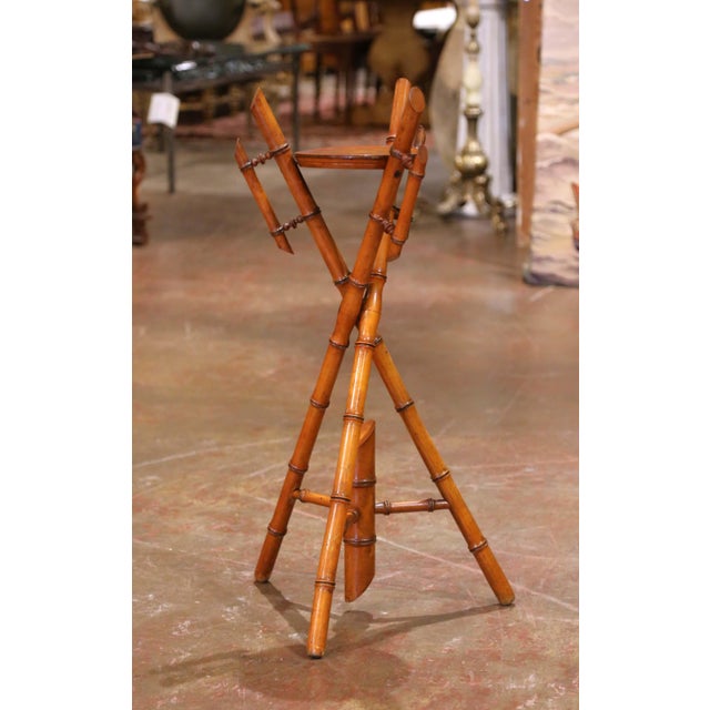 Crafted in France circa 1890, this authentic faux bamboo plant stand highlights the beauty and durability of genuine hand-...