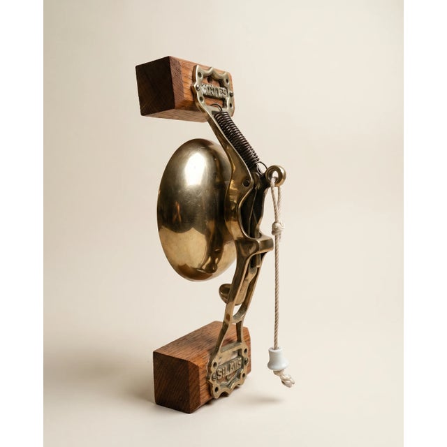 A scarce antique mechanical wall-mounted bell marked ST. L.C. CO. (St. Louis Car Company). Featuring a solid cast brass...