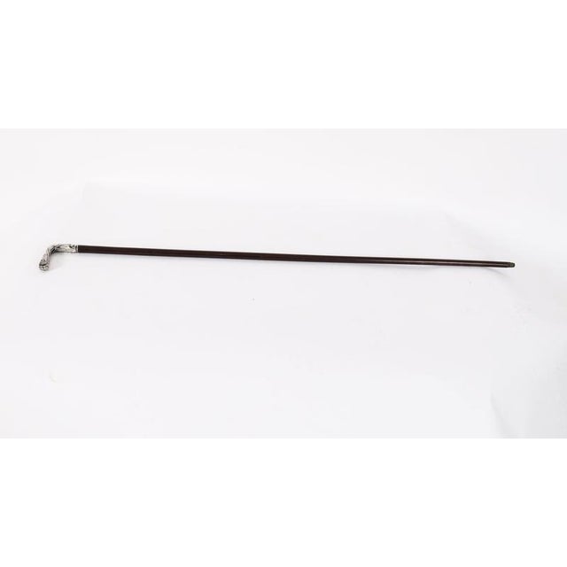 This is a beautiful antique French Art Nouveau silver L-shaped handle walking cane, late 19th Century in date. The...