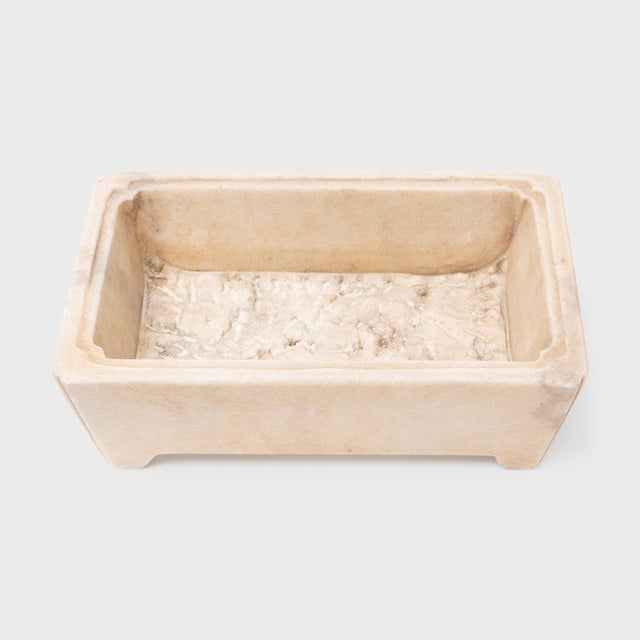 This elegant flower basin is hand-carved from white marble to a rectangular form commonly seen with incense burners or...