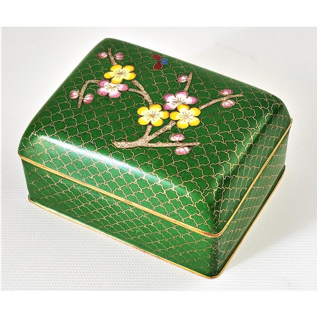 Offering a lovely small vintage Chinese cloisonné trinket or jewelry box, circa Mid 20th century. This brass hinged box...
