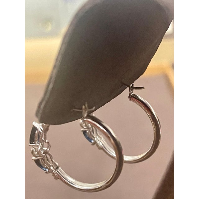 Pear Shape Sapphire & Diamond Hoop Cocktail Earrings in 14 Karat White Gold A fabulous pair of earrings with an enormous...