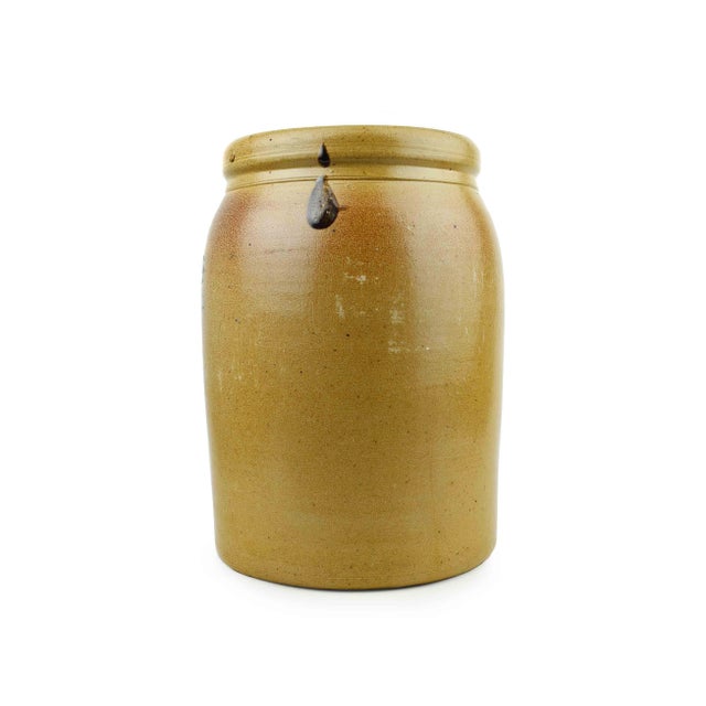 This charming antique stoneware crock is a piece of American history. Crafted in the early 1900s, it showcases the...