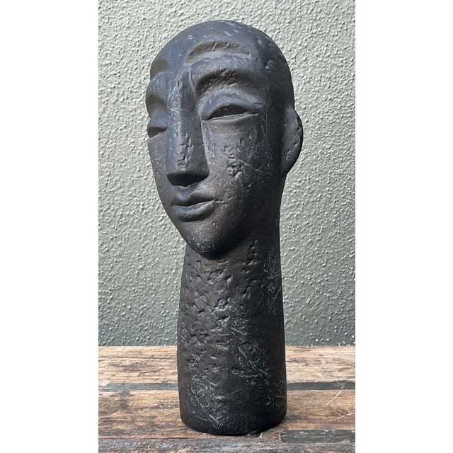 This compelling vintage ceramic bust is a masterclass in stylized abstraction, drawing inspiration from both West African...