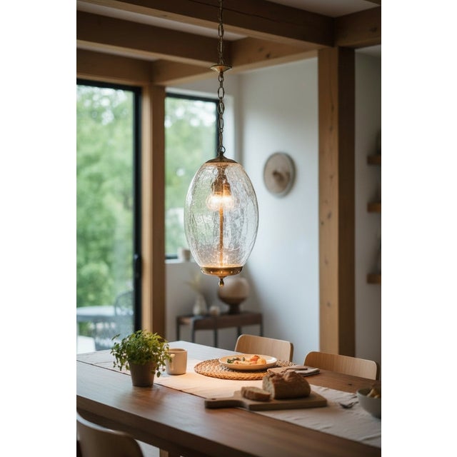 Elegant Italian pendant lantern crafted in Crackle Murano glass, dating to the 1960s. The oval-shaped shade is made of...