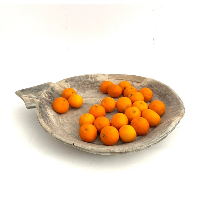 Large handcrafted wood parat bowl which was used for food preparation in India shows innovative and resourceful use of...