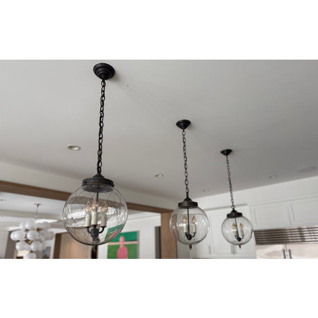 Remains Lighting Company - Sorenson 12" Lanterns A hand blown, clear glass globe is wrapped in handwoven wire fabric to...