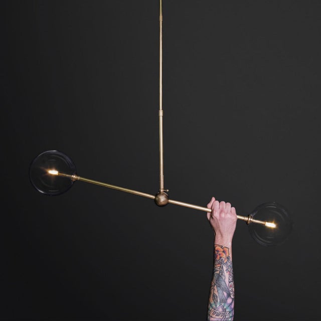 The Balance 150X150 pendant imagines harmony as a process, symmetry in motion balancing the forces of dynamic spaces. The...