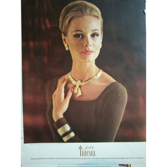 1962 goldtone "woven" curled ribbons brooch with security clasp. Marked crown "TRIFARI©" on the back. Measures: 2 1/8...