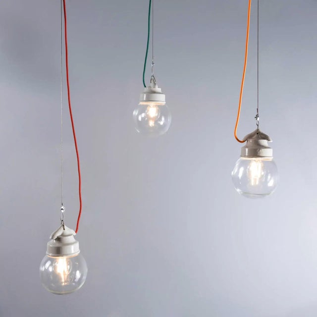 1950’s new old stock clear glass round pendant lamps. We have a large number of these stunning original hanging lamps...