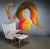 This expansive fiber art weaving by Janet Kuemmerlein boasts a vibrant palette of yellow, orange, reds, and greens,...