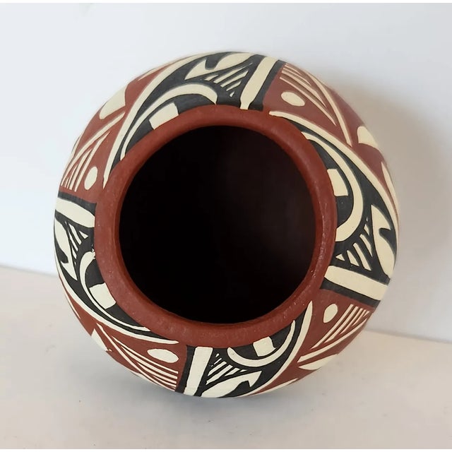 This is a lovely example of polychrome vessels created by artists of the Jemez Pueblo. This bowl was created by R. N. Toya...