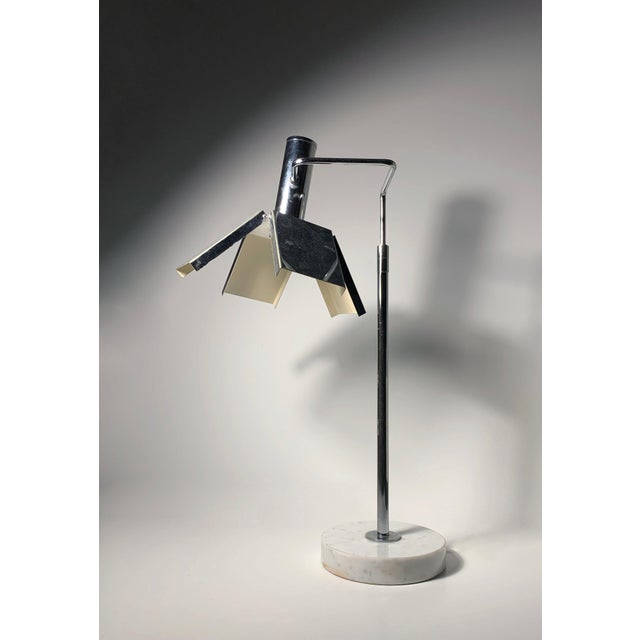 A attractive animated vintage modern lamp dating to the 1970s or 80s. Uncertain to the designer/maker. There are patent...