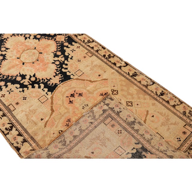 Beautiful antique Turkish Kurd hand-knotted runner with a beige color field. This piece has an all-over medallion floral...