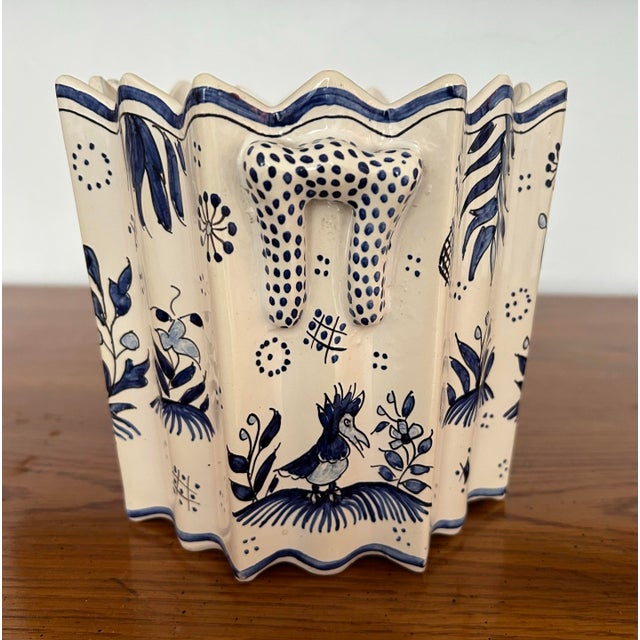 Made in France, fluted blue and white scalloped cache pot with little bow handles. Whimsical hand pained vines, birds and...