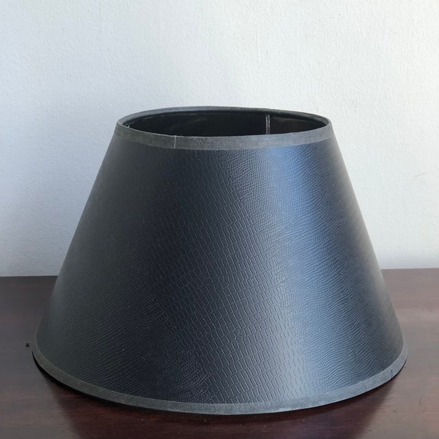 A lovely late-20th century Empire-style lamp shade in a solid black embossed reptile print pattern. This small clip-on...