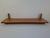 Elegant midcentury modern wall shelf designed and produced in Czechoslovakia during the 1960s. Made from solid wood, the...