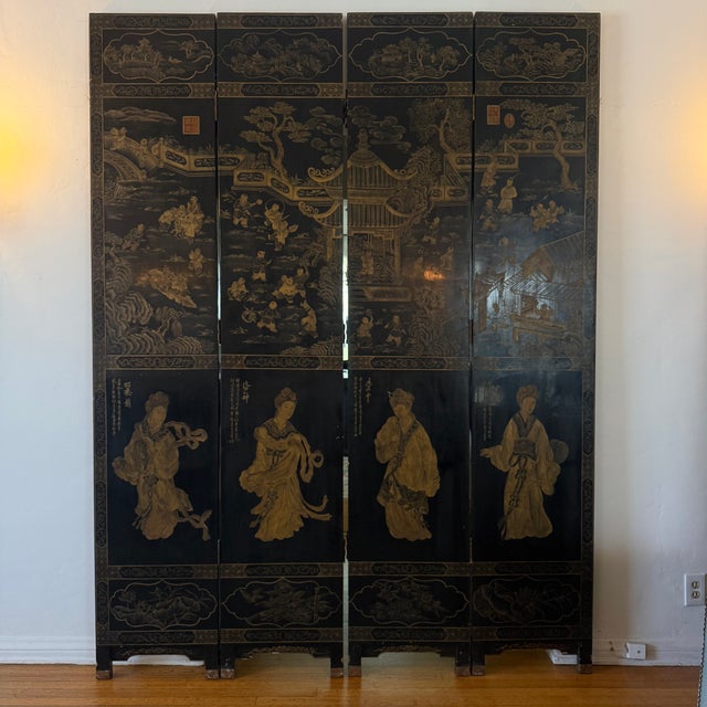 Monumental antique Chinese Coromandel-style Qing lacquer four-panel screen featuring finely detailed figural court scenes,...