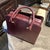 Animal Skin A 1990s Elegant Bordeaux Leather and Brass Top Handle Bag by Cartier For Sale - Image 7 of 15