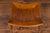 An English Egyptian Revival walnut Thebes stool from the early 20th century, with slatted curving seat and faux bamboo...