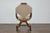 An Italian walnut Curule armchair from the 19th century with upholstered seat and back and X-Form carved base. This...