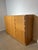 Timeless and minimalist solid oak sideboard by Vanda. This piece stands out through its clean architectural lines, warm...