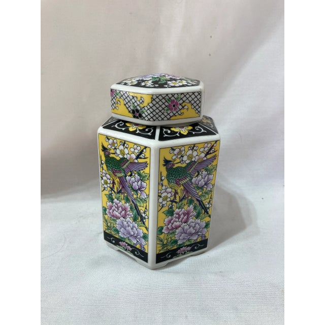 Colorful six sided tea container with flowers and pheasants.